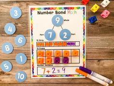 a number bond math game with legos on the table and numbers laid out next to it