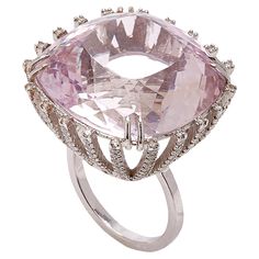 Sparkling Pink Kunzite & White Diamonds Ring features Custom Cushion Cut Faceted Kunzite that radiates prismatic hues of lavender and pink, presented on stunning diamond encrusted prongs with a supporting frame of full white diamond pave lines and shank set in 18k White Gold. 18k White Gold 17.96g, Kunzite, White Diamonds 1.51cts From Karma El Khalil's Linea Collection \ Pink Kunzite, White Diamond Ring, Ingredients List, Diamond Cocktail Rings, Custom Cushions, Diamonds Ring, White Diamonds, Cocktail Ring, Cushion Cut