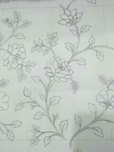 a drawing of flowers and leaves on a sheet of paper