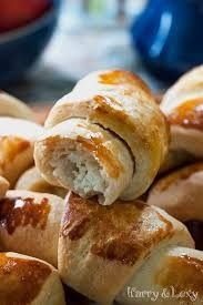 some bread rolls are stacked on top of each other and ready to be eaten in the oven