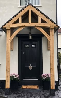 a black front door on a white house