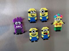 six minion bead magnets are arranged in the shape of cartoon character characters