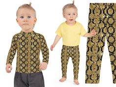 two toddlers wearing matching gold and black pajama pants, one in the foreground