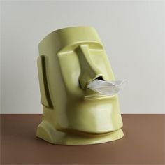 a tissue dispenser sitting on top of a table