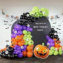 an assortment of balloons and decorations for a halloween party