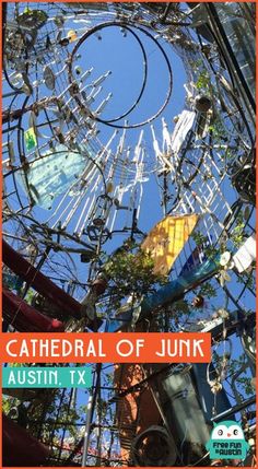 the cathedral of junk is surrounded by many metal structures and trees, with an orange border around it