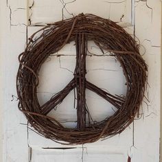 a peace sign made out of twigs on a door