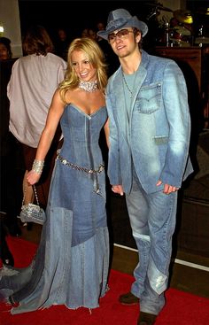 a man and woman dressed up in denim outfits