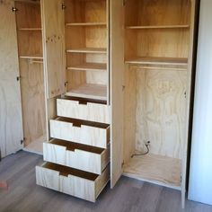 an unfinished closet with drawers and shelves in it