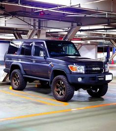 a toyota truck parked in a parking garage