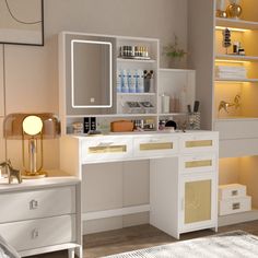 a white desk topped with a mirror next to a dresser