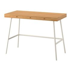 a wooden desk with two white legs and an open drawer on the bottom right side