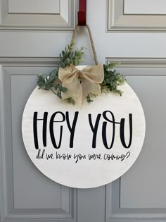 a sign that says hey you did we know you were coming? hanging on a door