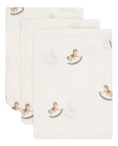 three napkins with horses printed on them