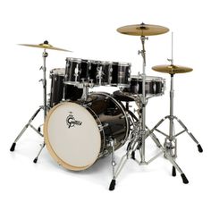 a black drum set sitting on top of a white floor