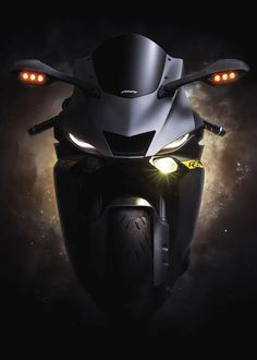 a motorcycle is shown with its lights on and it's headlight turned on