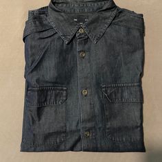 * Like Brand New Casual Washed Blue Shirt With Button Closure, Indigo Button-up Shirt With Pockets, Navy Button-up Casual Shirt, Casual Navy Button-up Shirt, Casual Blue Shirt With Buttoned Pockets, Casual Denim Blue Shirt With Button Closure, Casual Indigo Shirt With Pockets, Navy Casual Shirt With Buttons, Gap Short Sleeve Tops With Button Closure