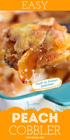 a spoonful of peach cobbler is being lifted from a casserole dish