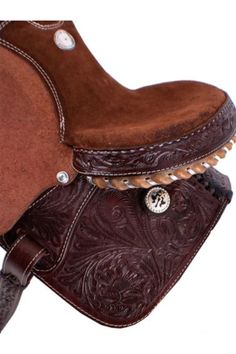 a saddle with brown leather and silver hardwares