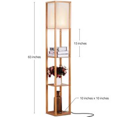 a tall wooden shelf with flowers and books on it's sides, measurements for the floor lamp