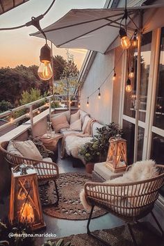 an outdoor patio with wicker furniture and lights