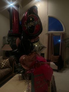 the balloons are all over the room and it's been decorated for someone's special occasion