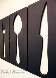 the words do it yourself and utensil art are displayed in front of two wooden spoons