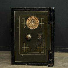 an old fashioned safe is sitting on the floor