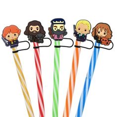 four different colored straws with harry potter characters on them and one is holding a wand