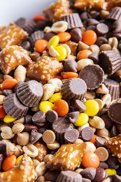 a bowl filled with candy and nuts on top of a table