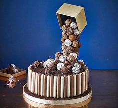 a chocolate cake with white and brown candies on top