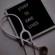 a stethoscope laying on top of a sign that says study to save lives