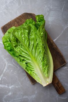 lettuce on a cutting board ready to be cut