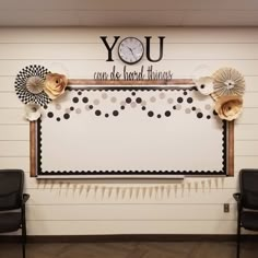 a white board with black and gold decorations in front of it that says you can be hard times