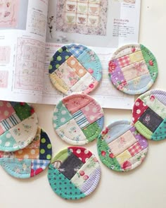 the book is open to show several patchwork coasters