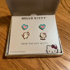 Add A Touch Of Cuteness To Your Outfit With This Set Of 2 Hello Kitty Earrings. The Earrings Feature Fine Silver Plated Hearts And A Kitty Design, Perfect For Any Hello Kitty Lover. The Earrings Are Multicolored And Come In A Stud Style, Making Them Easy To Wear And Comfortable On Your Ears. The Earrings Are A Great Addition To Any Jewelry Collection And Can Be Worn For Any Occasion. Get Your Hands On These Earrings Now And Show Off Your Love For Hello Kitty! Hello Kitty Stud Earrings, Jewelry Hello Kitty, Hello Kitty Earrings, Hello Kitty Jewelry, Stud Style, Stud Earrings Set, Stud Earring, Fine Silver, Earring Set