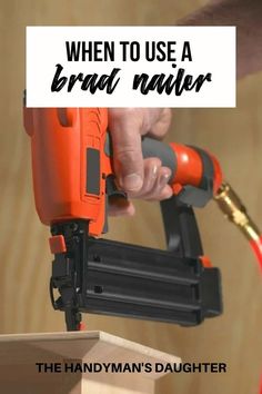 a person is using a brad nailer to fix a piece of wood with the words, when to use a brad nailer, the handyman's daughter