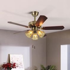 a ceiling fan with five lights in a room