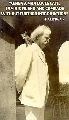 an old black and white photo of a man with a cat on his shoulder looking at him