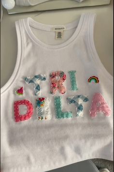 a white tank top with the word girl on it