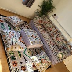 a living room filled with lots of furniture and rugs