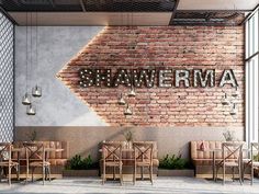 an empty restaurant with brick walls and wooden chairs