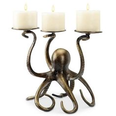 an octopus candle holder with three candles