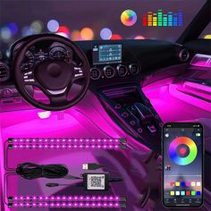 the interior of a car is shown with various colored lights and electronics on display in front of it