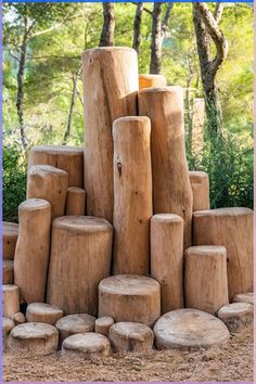 a pile of logs sitting in the middle of a forest