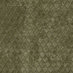 an upholstered green fabric with diamond shapes