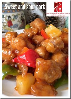 sweet and sour pork with peppers on a white plate