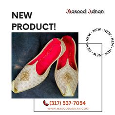 a pair of red and white shoes with the words new product