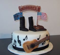 a cake decorated with musical instruments and flags