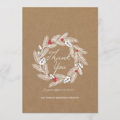 a brown card with a wreath on it that says, thank you the team at american creative